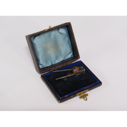 65 - A pair of Victorian miniature steel nut crack brooch, registration number for 1885, 4.5cm l.