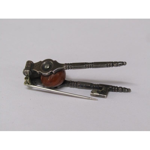 65 - A pair of Victorian miniature steel nut crack brooch, registration number for 1885, 4.5cm l.