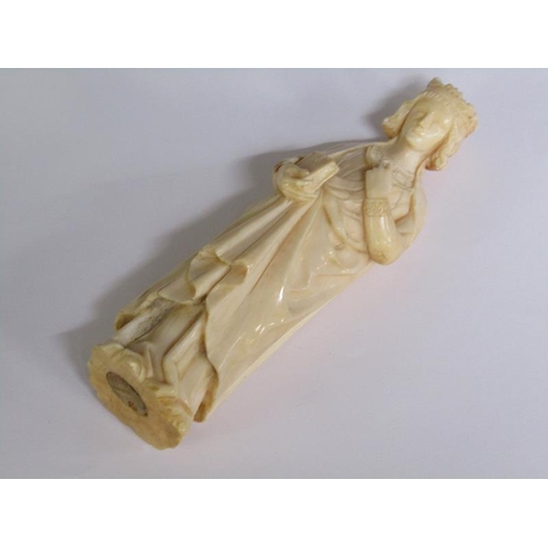 68 - A 19c European carved ivory figure of a standing female with crown, cloaked and holding a book in he... 