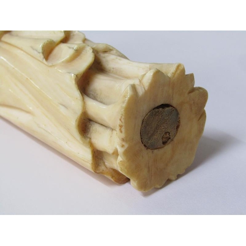 68 - A 19c European carved ivory figure of a standing female with crown, cloaked and holding a book in he... 