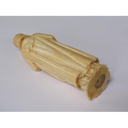 68 - A 19c European carved ivory figure of a standing female with crown, cloaked and holding a book in he... 