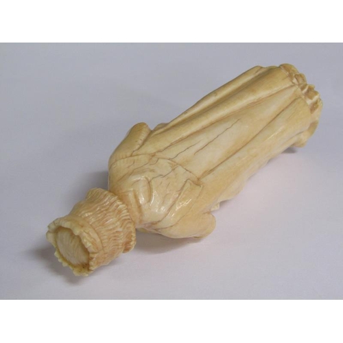 68 - A 19c European carved ivory figure of a standing female with crown, cloaked and holding a book in he... 