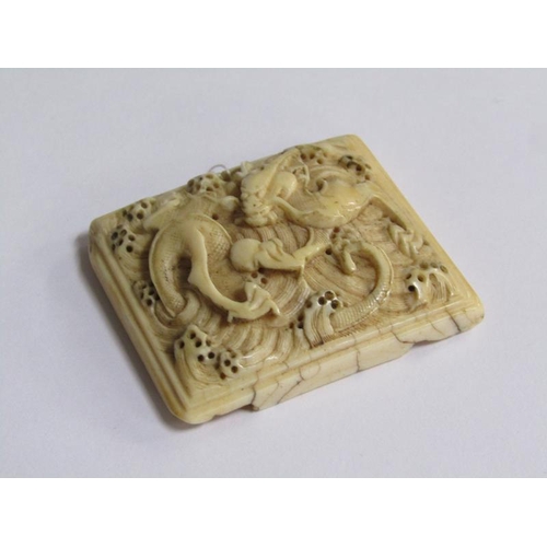 71 - An early 17c Ming type ivory belt buckle, dragon and pearl carved, 4cm x 5cm.