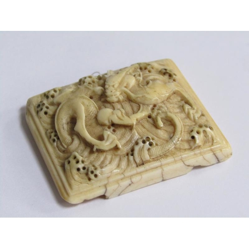 71 - An early 17c Ming type ivory belt buckle, dragon and pearl carved, 4cm x 5cm.