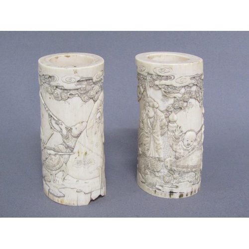 73 - A pair of Japanese ivory vases carved with a scene of Shoulao seated and with children and attendant... 
