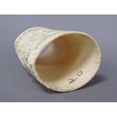 73 - A pair of Japanese ivory vases carved with a scene of Shoulao seated and with children and attendant... 