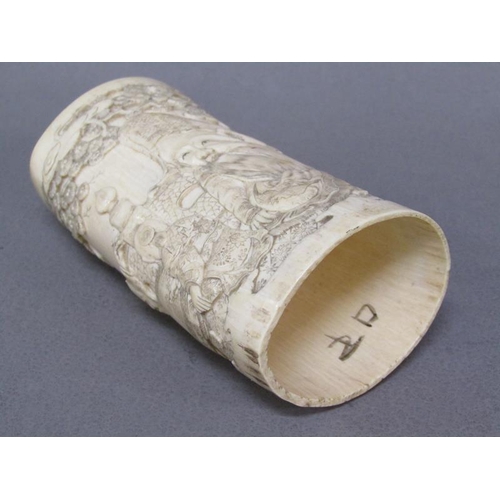 73 - A pair of Japanese ivory vases carved with a scene of Shoulao seated and with children and attendant... 