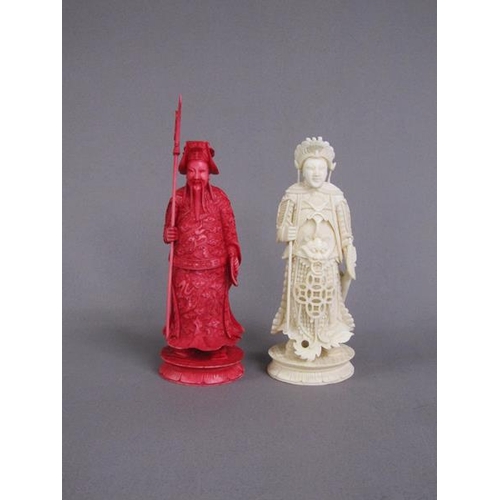 74 - Two Cantonese carved ivory chess pieces, one white, the other stained red, 13cm & 15cm h.