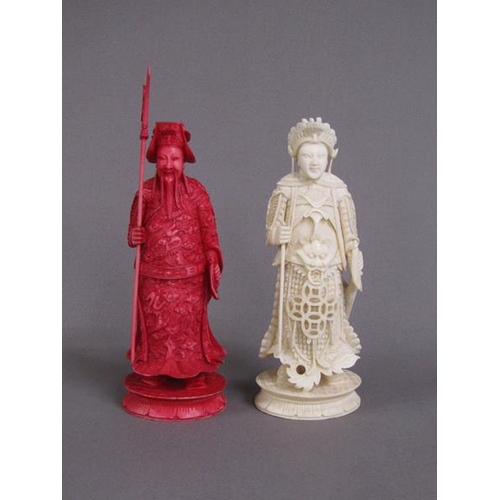 74 - Two Cantonese carved ivory chess pieces, one white, the other stained red, 13cm & 15cm h.