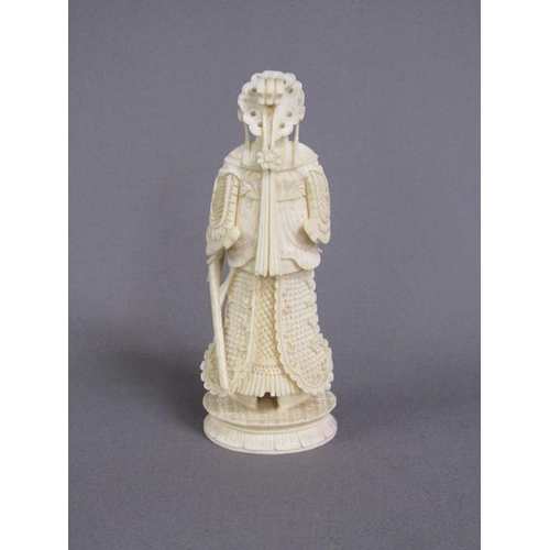 74 - Two Cantonese carved ivory chess pieces, one white, the other stained red, 13cm & 15cm h.