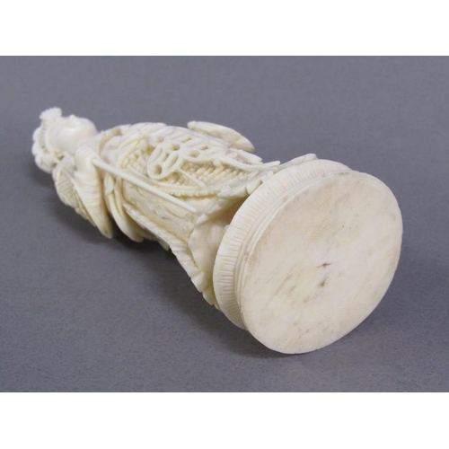 74 - Two Cantonese carved ivory chess pieces, one white, the other stained red, 13cm & 15cm h.