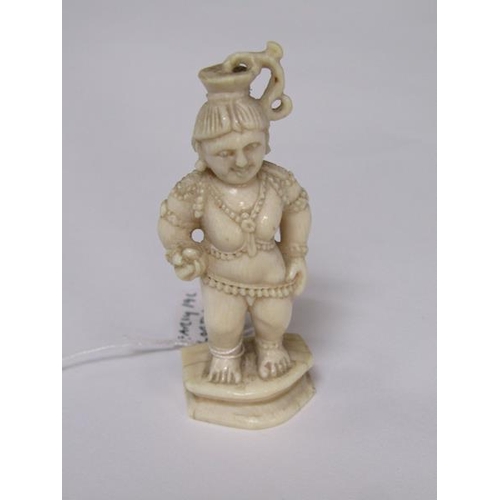 75 - A 19c Indian ivory carving depicting Lord Krishna, 6cm h.