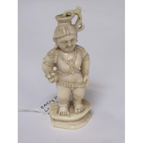 75 - A 19c Indian ivory carving depicting Lord Krishna, 6cm h.
