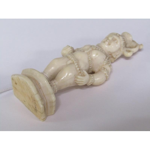 75 - A 19c Indian ivory carving depicting Lord Krishna, 6cm h.