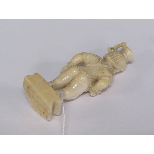 75 - A 19c Indian ivory carving depicting Lord Krishna, 6cm h.