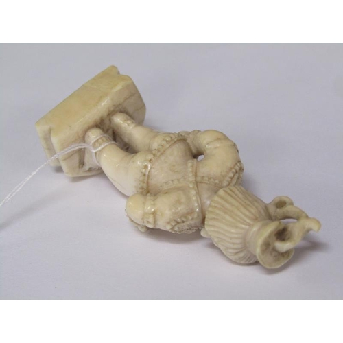 75 - A 19c Indian ivory carving depicting Lord Krishna, 6cm h.