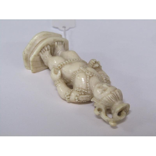 75 - A 19c Indian ivory carving depicting Lord Krishna, 6cm h.