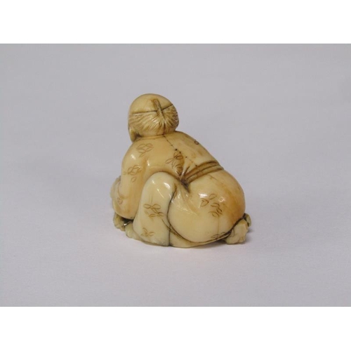 76 - A Japanese Meiji period carved ivory netsuke depicting a mask maker, 4cm w, base signed.