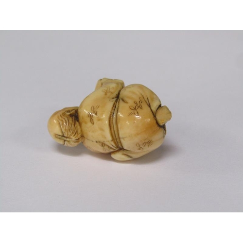76 - A Japanese Meiji period carved ivory netsuke depicting a mask maker, 4cm w, base signed.