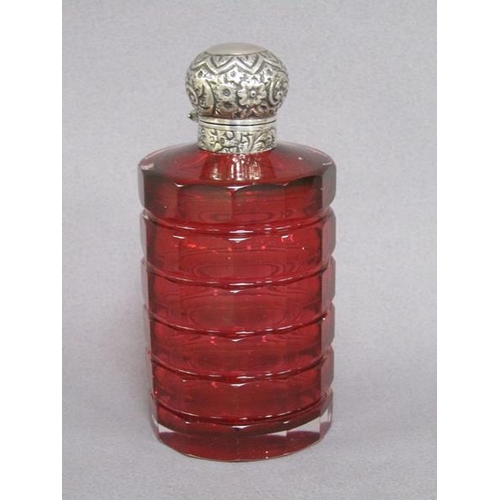 79 - A late Victorian ruby glass scent bottle, facet cut and with an embossed silver hinged dome top and ... 