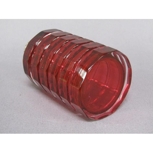 79 - A late Victorian ruby glass scent bottle, facet cut and with an embossed silver hinged dome top and ... 