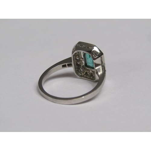 140 - A platinum emerald (0.9ct) and diamond (total 0.5ct) cluster ring, size N/O.