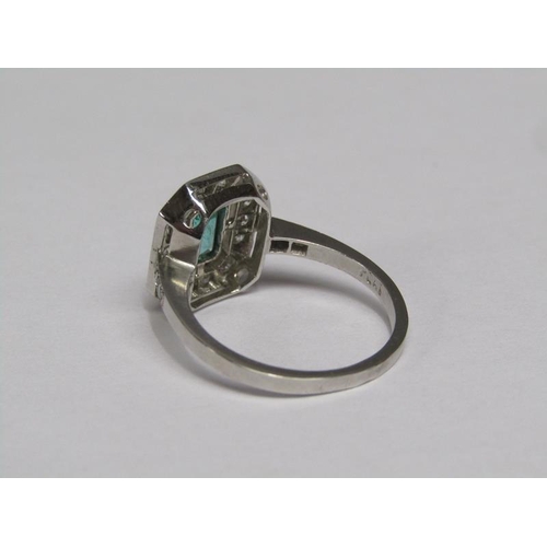140 - A platinum emerald (0.9ct) and diamond (total 0.5ct) cluster ring, size N/O.