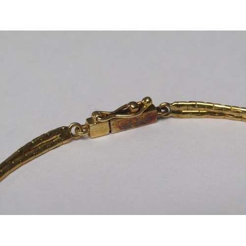 143 - An 18ct gold emerald and diamond set bracelet.