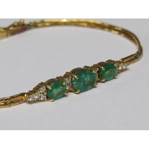 143 - An 18ct gold emerald and diamond set bracelet.