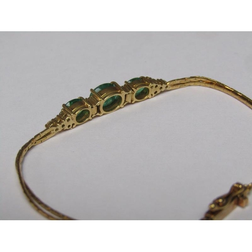 143 - An 18ct gold emerald and diamond set bracelet.
