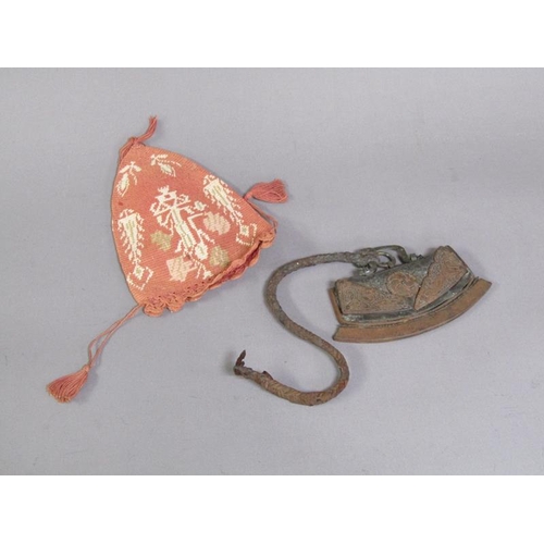 A 17c/18c Asian chuckmuck with leather pouch and curved steel striker ...