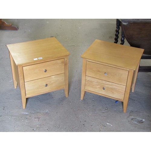 669 - TWO MODERN OAK BEDSIDE CUPBOARDS