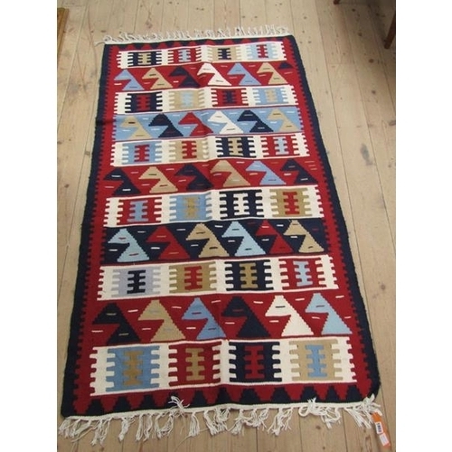 1802 - ORIENTAL GEOMETRIC PATTERNED RUG WITH RED, BLUE AND FAWN GROUND 175 x 99 cms