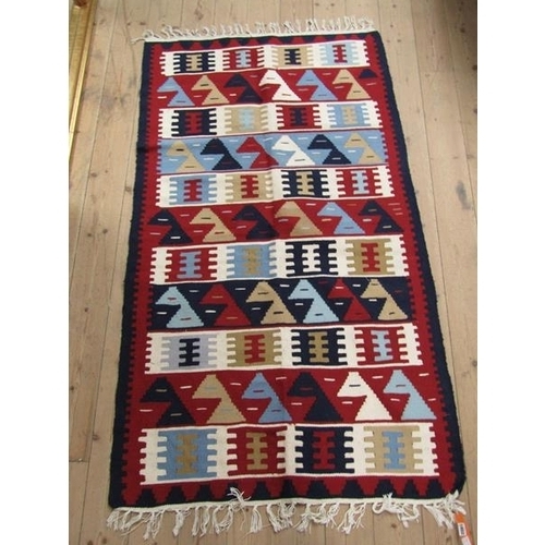 1802 - ORIENTAL GEOMETRIC PATTERNED RUG WITH RED, BLUE AND FAWN GROUND 175 x 99 cms