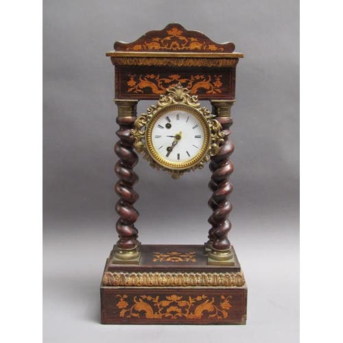 27 - A mid 19c French portico clock, the movement held between four barley sugar twist columns which stan... 