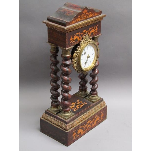 27 - A mid 19c French portico clock, the movement held between four barley sugar twist columns which stan... 