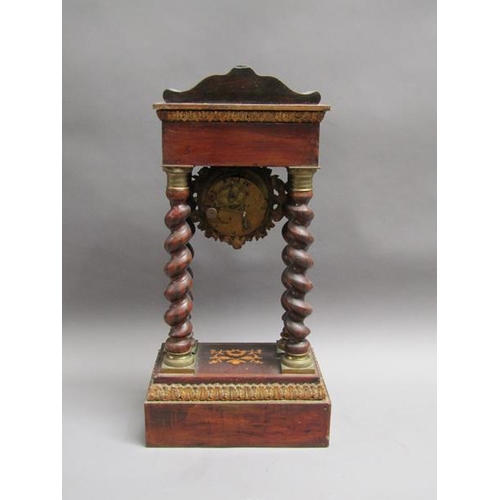27 - A mid 19c French portico clock, the movement held between four barley sugar twist columns which stan... 