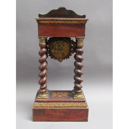 27 - A mid 19c French portico clock, the movement held between four barley sugar twist columns which stan... 