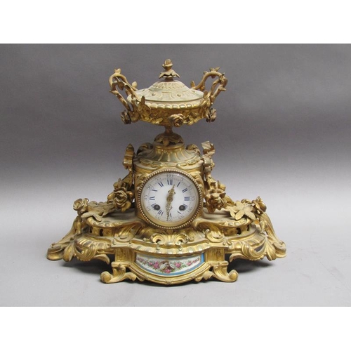28 - A late 19c French gilt mantel clock, the case decorated with swags and foliage and having an inset p... 