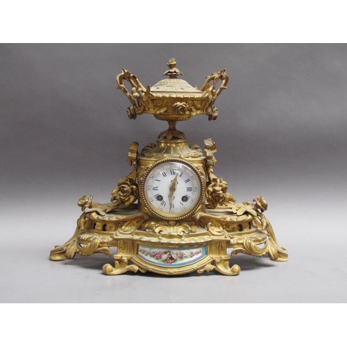28 - A late 19c French gilt mantel clock, the case decorated with swags and foliage and having an inset p... 