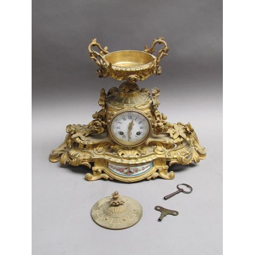 28 - A late 19c French gilt mantel clock, the case decorated with swags and foliage and having an inset p... 