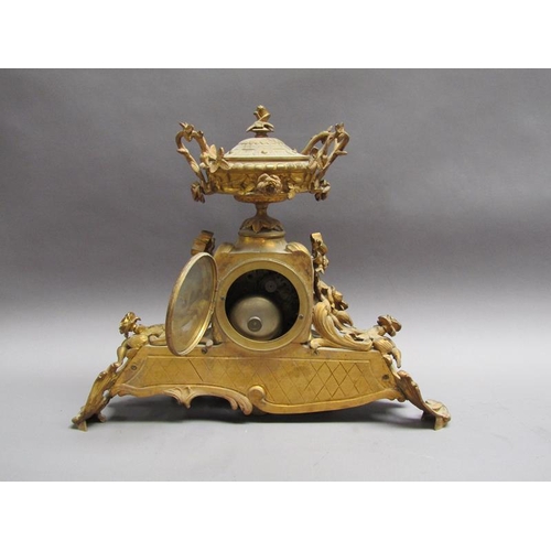 28 - A late 19c French gilt mantel clock, the case decorated with swags and foliage and having an inset p... 