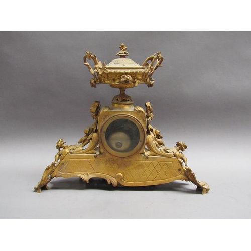 28 - A late 19c French gilt mantel clock, the case decorated with swags and foliage and having an inset p... 