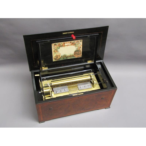 35 - A late 19c Swiss music box having a 27.5cm barrel playing two thirty seven tooth combs plays a fifte... 