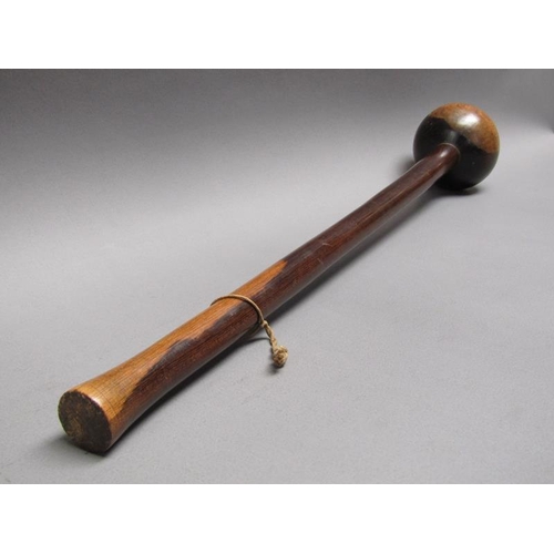 25 - A Lignum vitae throwing club with a ball shaped end, 59cm l.