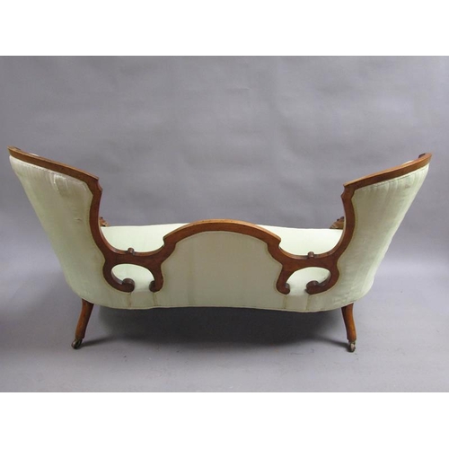 293 - A Victorian walnut show framed and upholstered double end sofa of serpentine form, the framed carved... 
