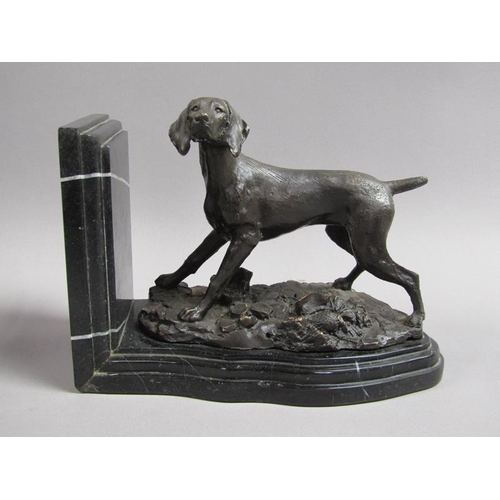 43 - A pair of late 19c black patinated metal gun dog book ends, the pointer dogs on rocky bases with imp... 