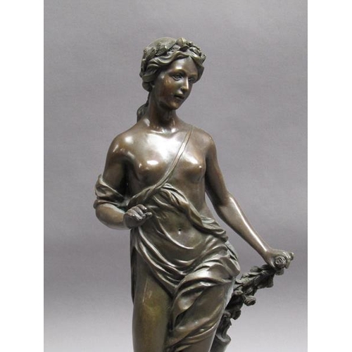 47 - A 19c French patinated bronze figure of a classical female with a spray of leaf and roses in her lef... 