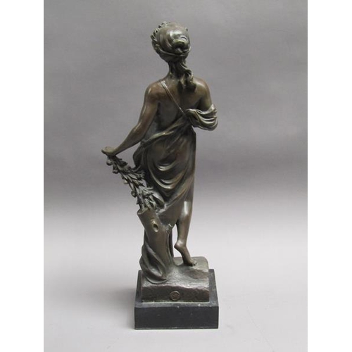 47 - A 19c French patinated bronze figure of a classical female with a spray of leaf and roses in her lef... 