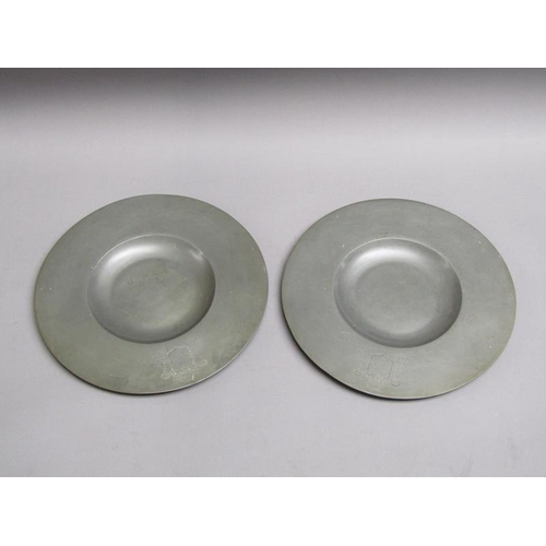 52 - Two 19c pewter platters of circular form with dished centres and etched Coat of Arms, each 30cm diam... 